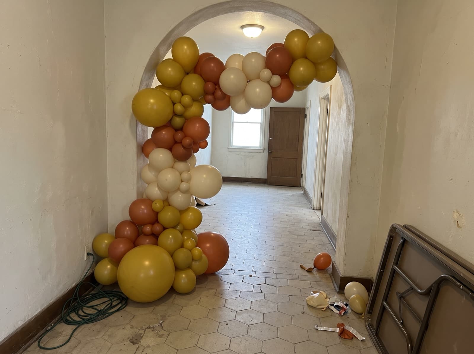 Balloon garland around an arched interior doorway