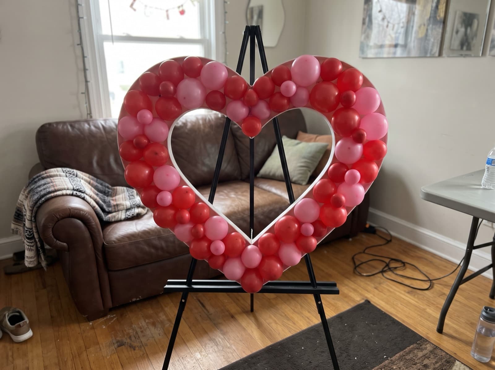 Heart-shaped balloon mosaic in red and pink