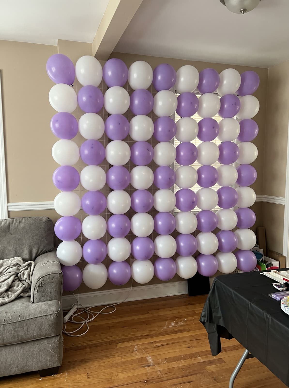 Grid balloon wall in a lavender and white checkerboard
