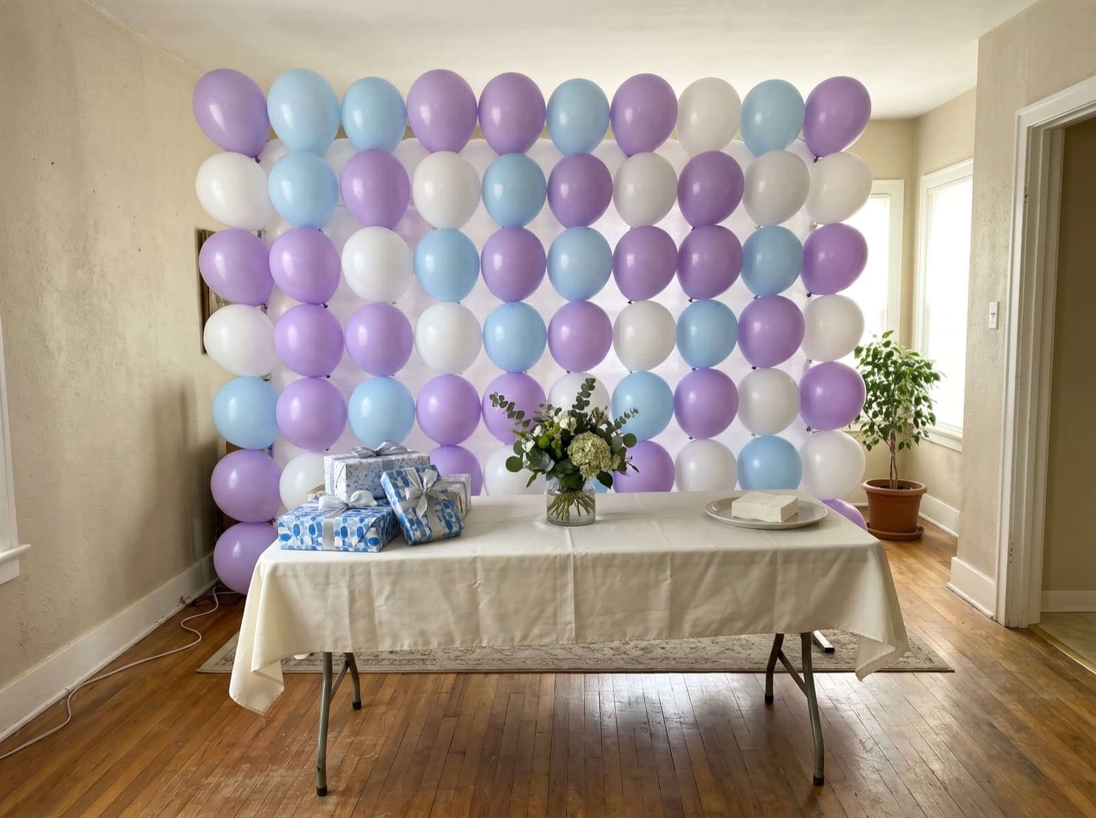 Pastel balloon wall in lilac, pale blue and white